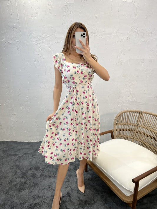 Robe mi-longue sans manches à imprimé floral avec détails à volants