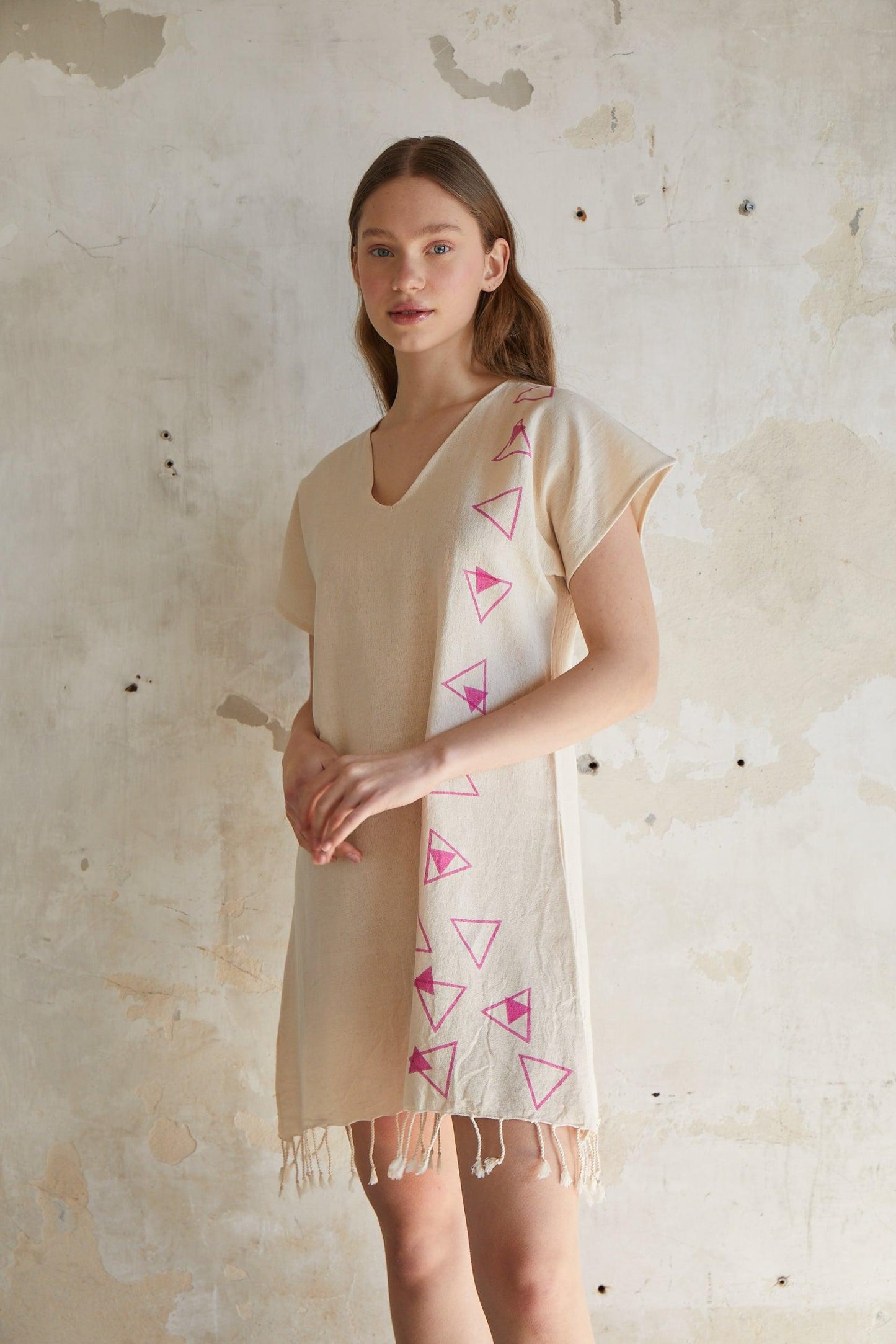 Pink geometric woodcut printed short sleeve mini beach dress with tassels hem in natural beige %100 organic cotton - trendynow
