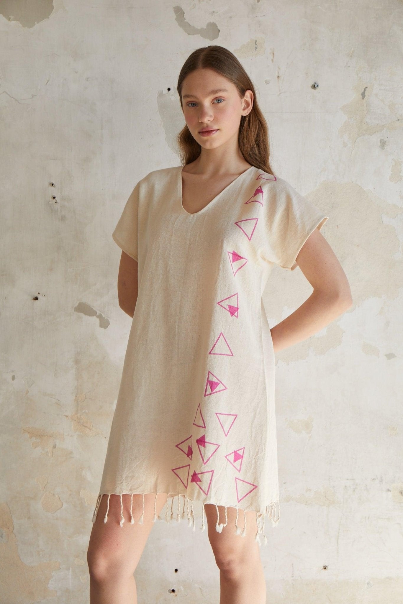 Pink geometric woodcut printed short sleeve mini beach dress with tassels hem in natural beige %100 organic cotton - trendynow