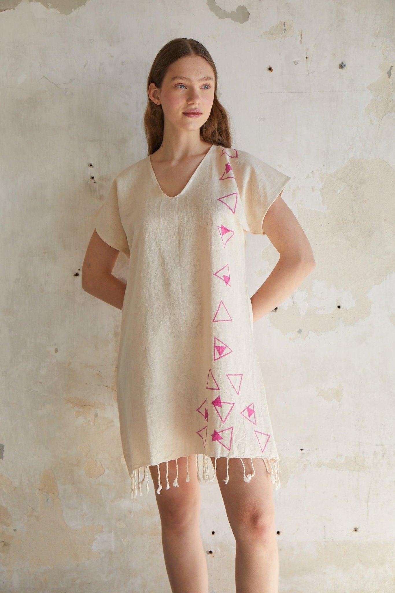 Pink geometric woodcut printed short sleeve mini beach dress with tassels hem in natural beige %100 organic cotton - trendynow